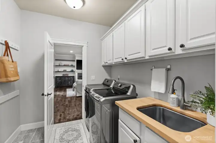 Spacious utility room off the garage—perfect for laundry and organization.