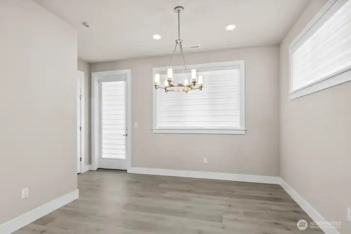 Dining room opens to the patio which overlooks the meadow.  A huge covered Trex deck spans the entire width of home.