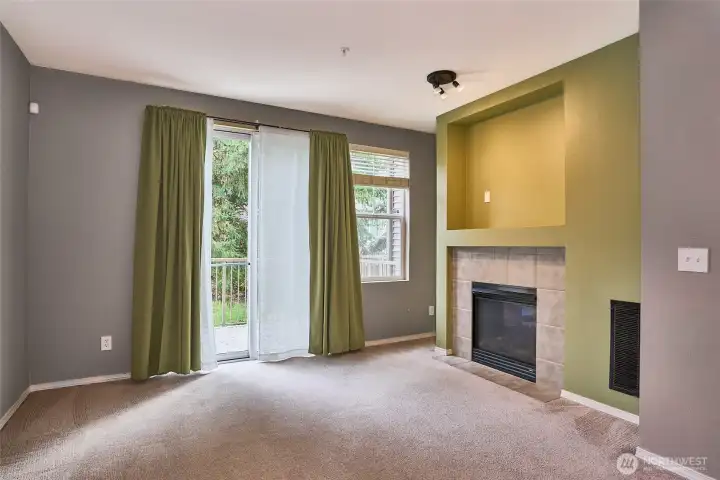 Living room with sliding door to deck balcony.