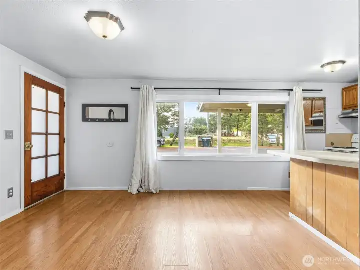Inside the entrance to the condo. With open concept living and great natural light.