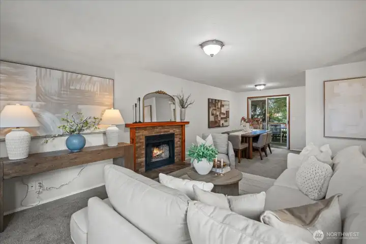 The living room seamlessly connects to the dining room and kitchen for easy every day living and entertaining with access to the deck just beyond, making it perfect for extended gatherings outdoors.