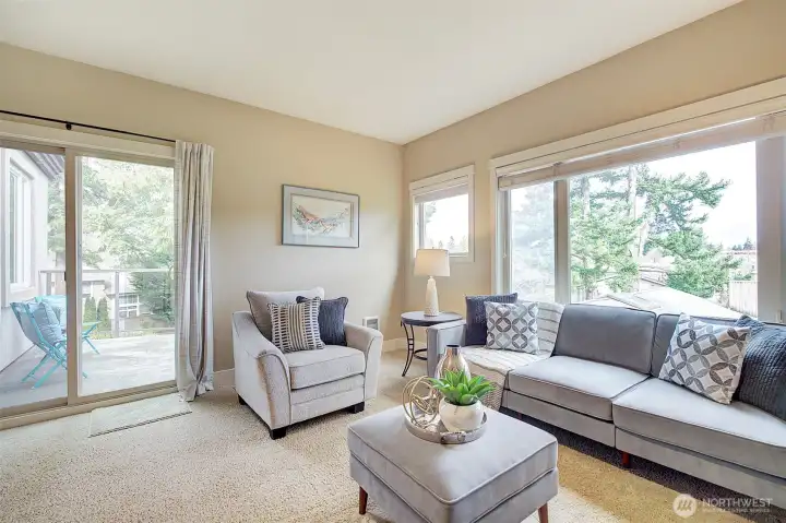 The large living room with territorial views and sliding doors to the private balcony.