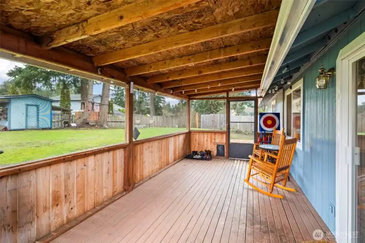 The covered, screened-in back deck offers room to grill and relax protected from the PNW drizzle and pesky summer bugs.