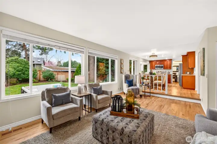 From here, the family room shows its comfortable scale and strong connection to the kitchen and informal dining area. This open relationship between the spaces makes the floorplan especially appealing for both daily life and entertaining.