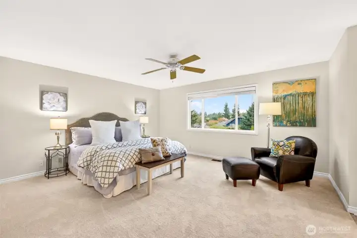The spacious primary suite offers room to spread out and create a true retreat at the end of the day. New carpet adds comfort underfoot, while the large window brings in natural light and a pleasant outlook.