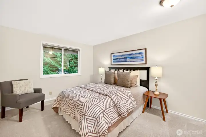 One of the secondary bedrooms offers comfortable dimensions, natural light, and flexibility for guests, hobbies, or daily use. New carpet helps give the room a clean, updated feel.