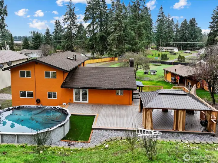 From up the hillside; exterior back of home