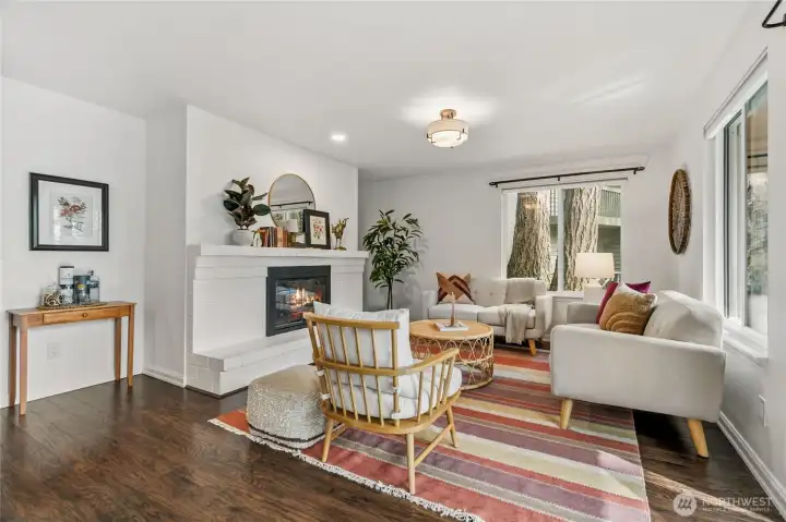 Living room showcasing the cozy wood burning fireplace