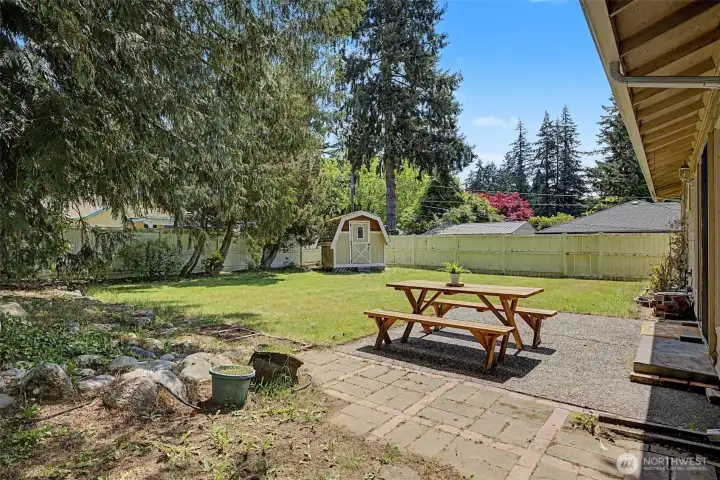 HUGE backyard with nice patio, shed and garden beds. Fully fenced.