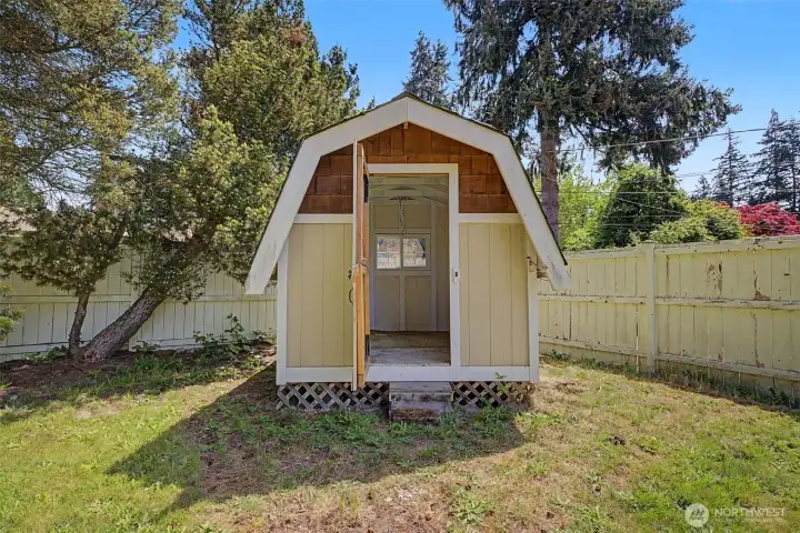 shed in backyard for extra storage. Another smaller shed around corner of home