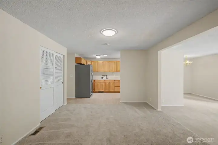 New carpet in dining room opens to kitchen