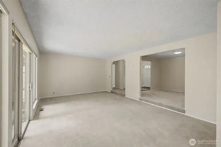 The living room is a step down from the entry. very large space would welcome lots of furniture