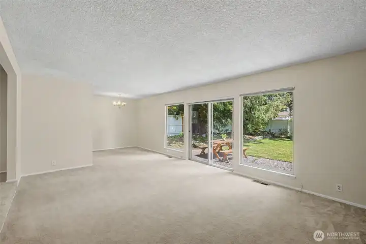 Another look at the living room and large windows looking out onto backyard