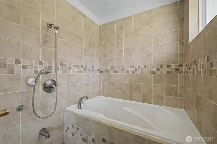 Japanese soaker tub in primary bedroom