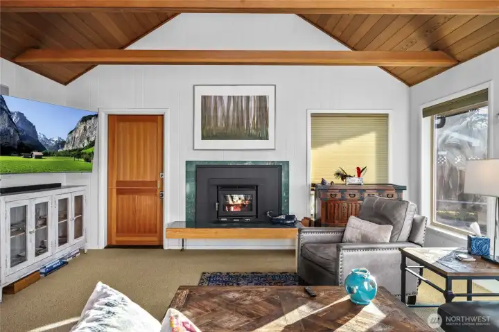 Living room with Dutch door to the left of the fireplace.  Let the outdoors in!