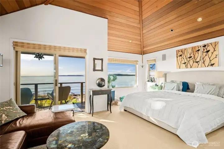 Primary suite on upper floor with a balcony and endless views