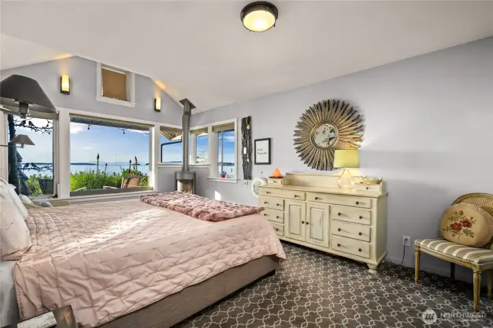 Second primary suite on main floor with gas fireplace and lovely views