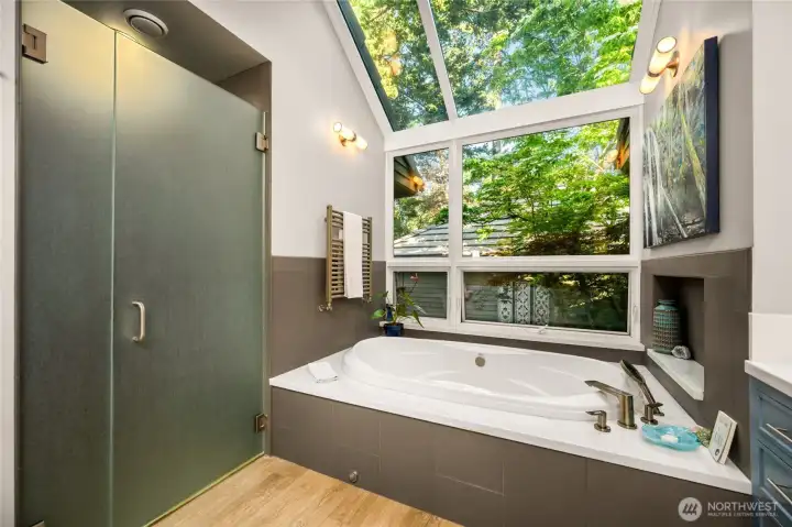 Primary bathroom with glassed-in shower and tree canopy!