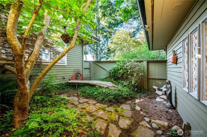 Private reflecting garden between house and garage