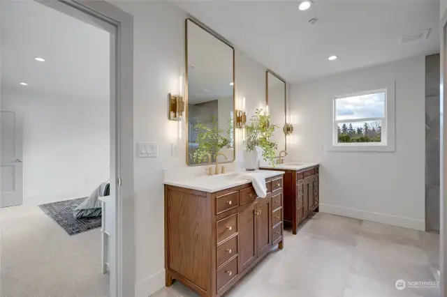 Primary Bathroom has dual undermount sinks and lots of storage