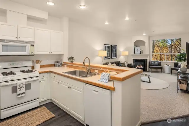 Kitchen provides ample prep and storage space, including pantry cabinet.