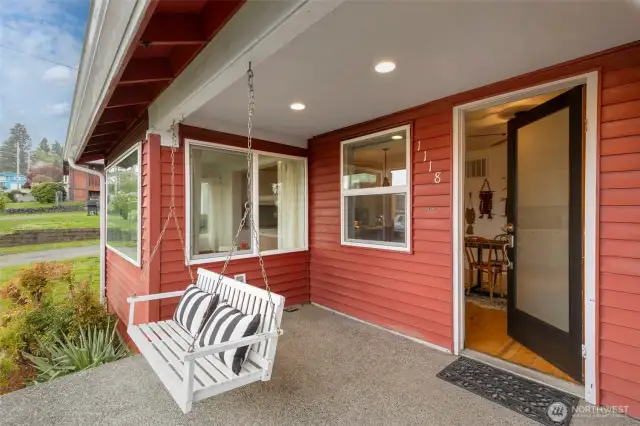 You’ll swoon over the covered front entry with an inviting porch swing!