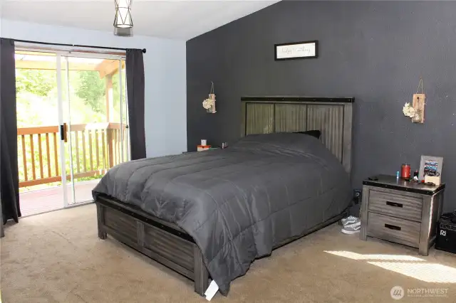 Large primary bedroom with its own deck