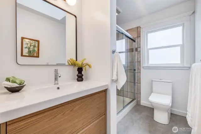 Freshly updated bathroom. Recirculating pump for the shower to deliver instant hot water.