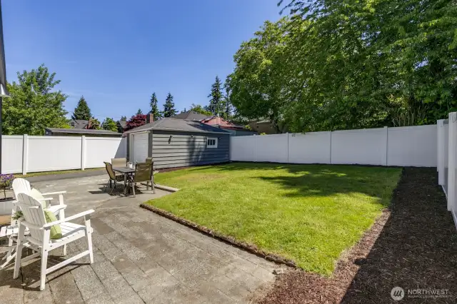 This backyard soaks in the sun. Bring your gardening gloves and imagination!