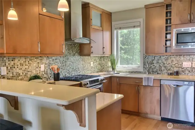 The kitchen is spacious, open with breakfast bar.