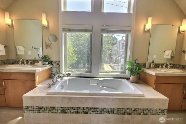 Primary bath has a luxurious soaking tub.