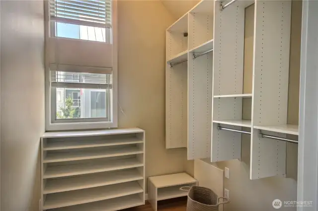 Walk-in closet with organizers.