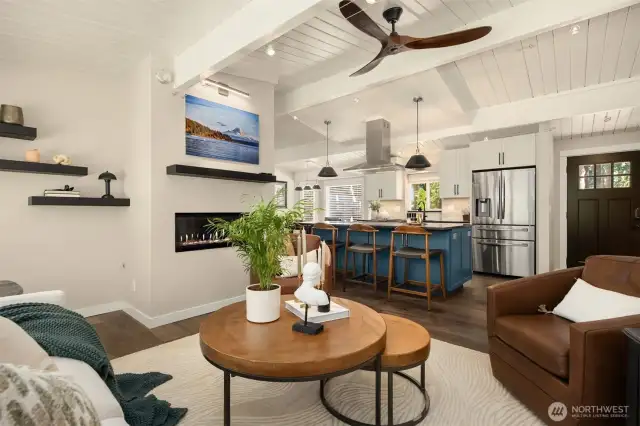 The main living room is open to the large kitchen which allows room for company to relax while hosts aren't secluded.