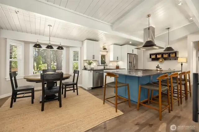 Main dining area with new updated fixtures and plenty of room for a full dining table.