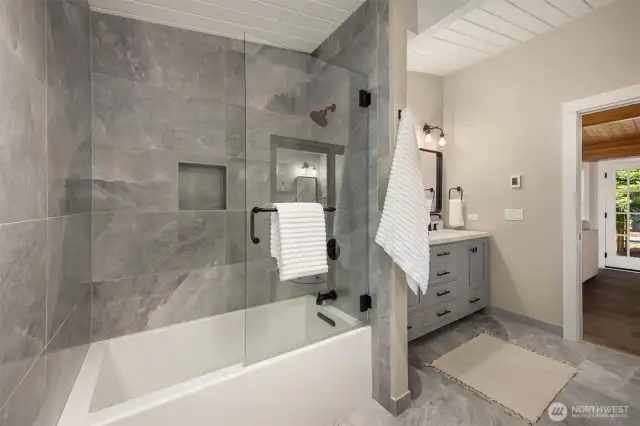 Bathroom includes tub and shower. Glass is spot free and special spot resistant treated.