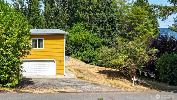 On Inverness Court, facing north towards the house, the water is to your right.
