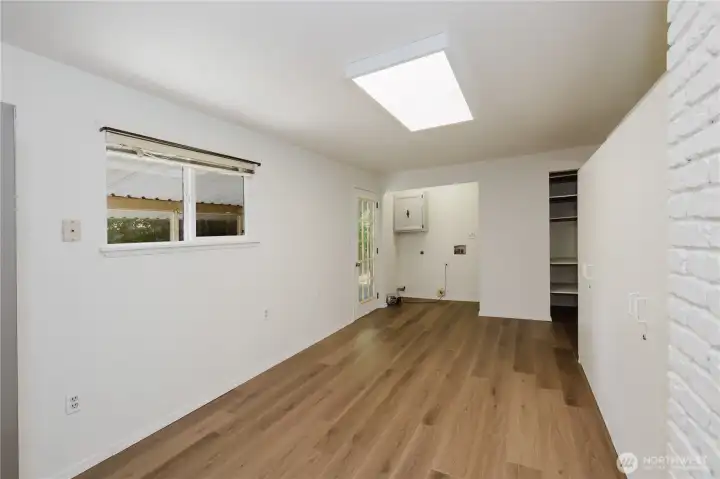 Dining room with the back door to the covered porch area.