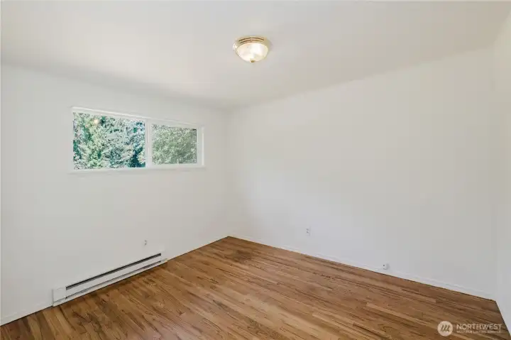 One of the three bedrooms, again the real hardwood floors were completely restored to their original glory.