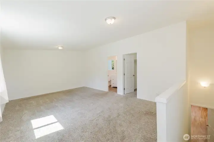 This big upstairs room could be the primary bedroom if you do not want it on the main floor.