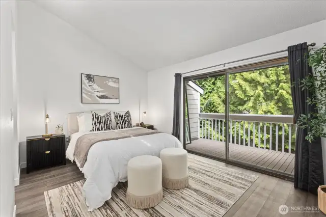 Peaceful primary bedroom with private deck access.