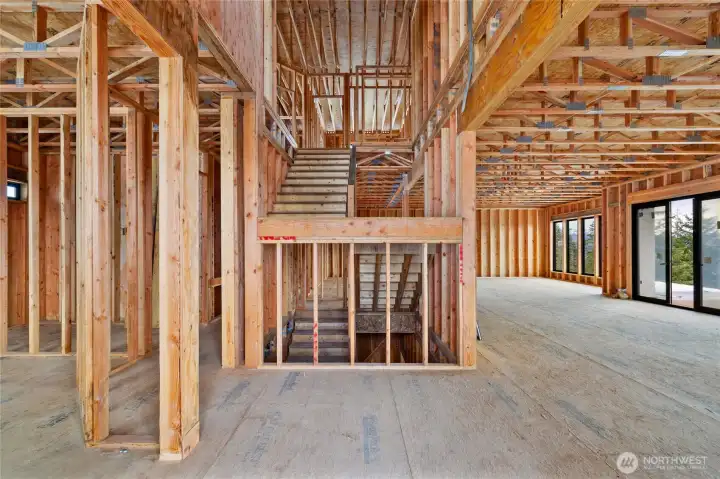 Entry area, den on the left side, living room on the right side and looking into the dining room at the far end.