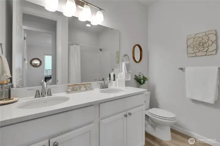 Full guest bath with double sinks, just steps from 2nd & 3rd bedrooms ~