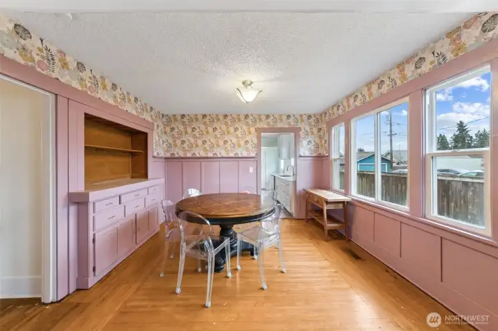 Dining room with more built-ins. Original hardwood floors and open to the living area