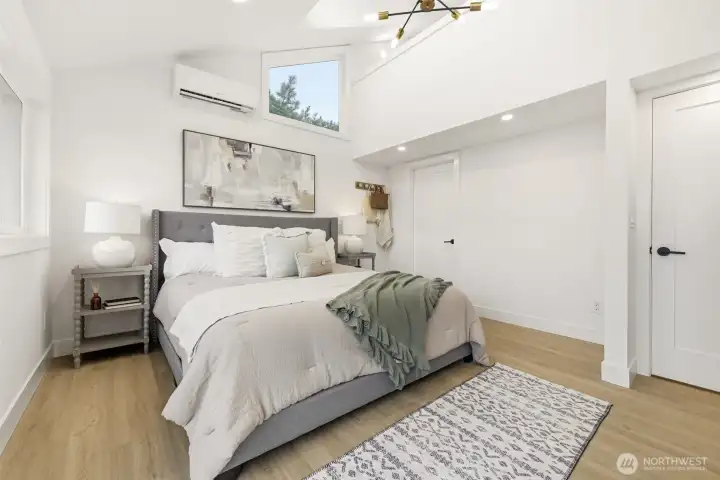 Primary suite with a vaulted ceiling and mini split for heating & cooling.