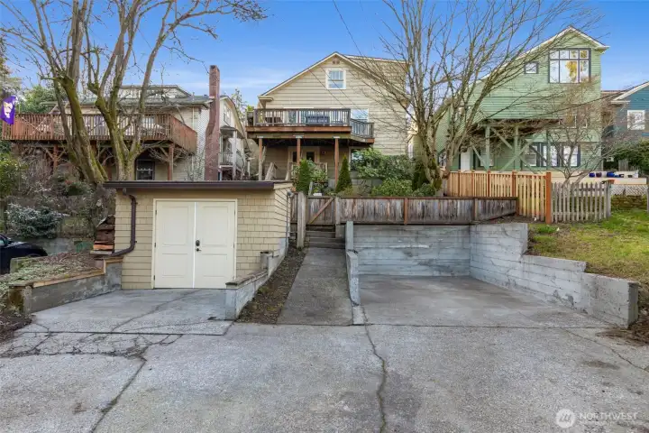 Off-street parking for two cars in the alley. Space to the right is EV-ready. Newer shed is very sturdy with power and a brand new roof. Could be a great studio or office - or even more storage!