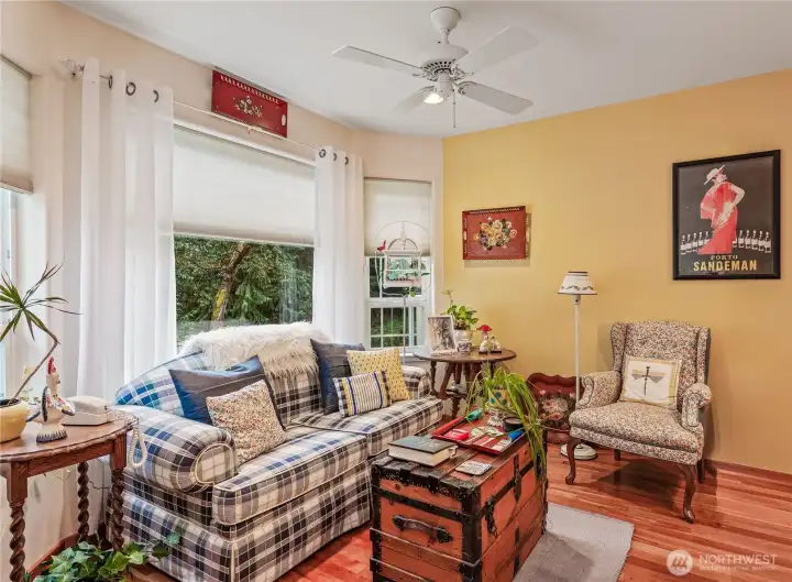 Sunny eating nook near kitchen, perfect for entertaining.