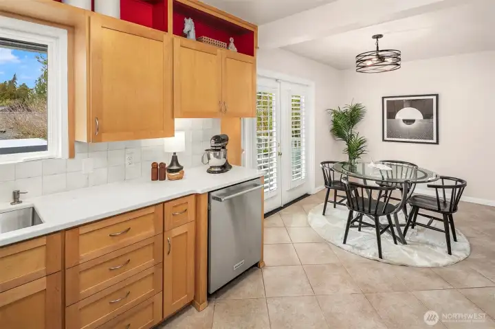 Extra eating space in the kitchen which leads to the newly refinished covered back deck.