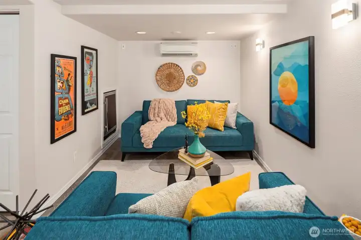 The basement media room has tons of options for how to arrange. The wine fridge is shown here.