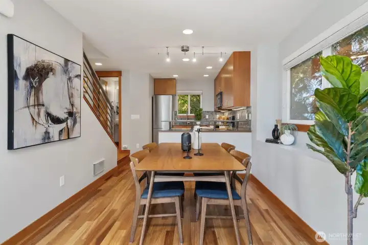 The living room flows seamlessly into the dining area and kitchen.