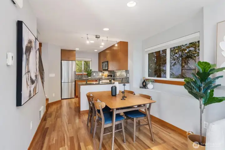 The living room flows seamlessly into the dining area and kitchen.